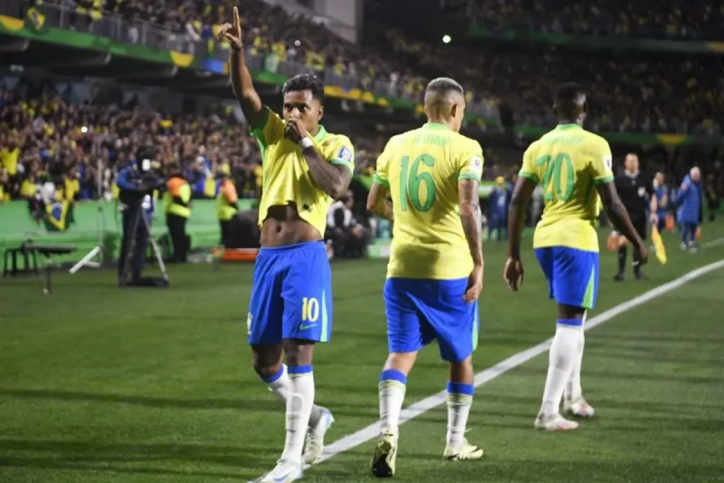 Brazil forward Rodrygo (left) celebrates scoring against Ecuador.