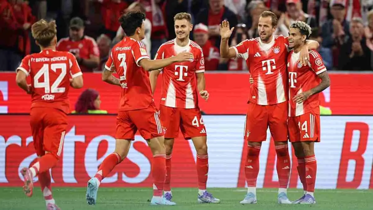 Harry Kane celebrates his hat-trick against RB Leipzig